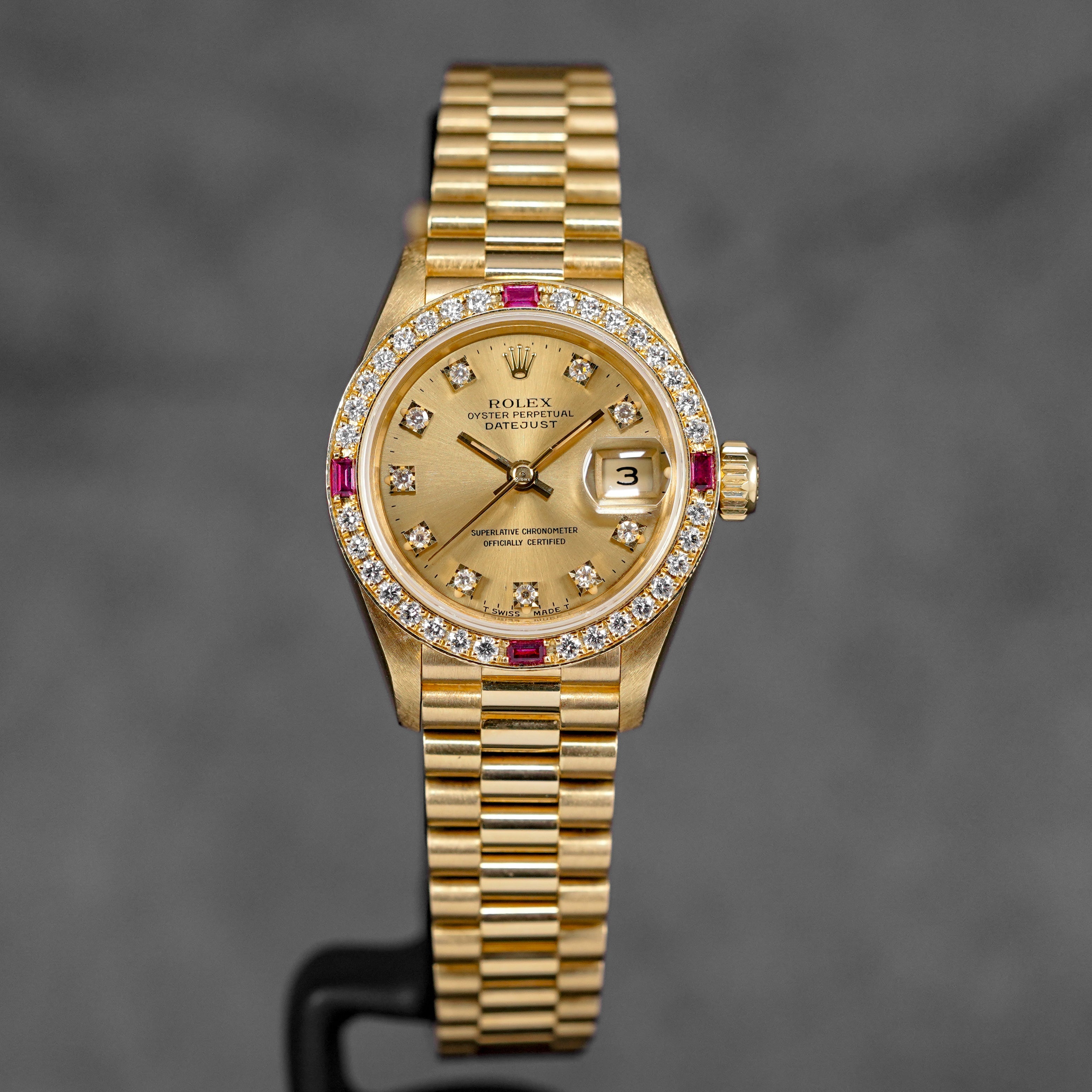 DATEJUST 26MM YELLOWGOLD CHAMPAGNE DIAMOND DIAL RUBY DIAMOND BEZEL (WATCH ONLY)