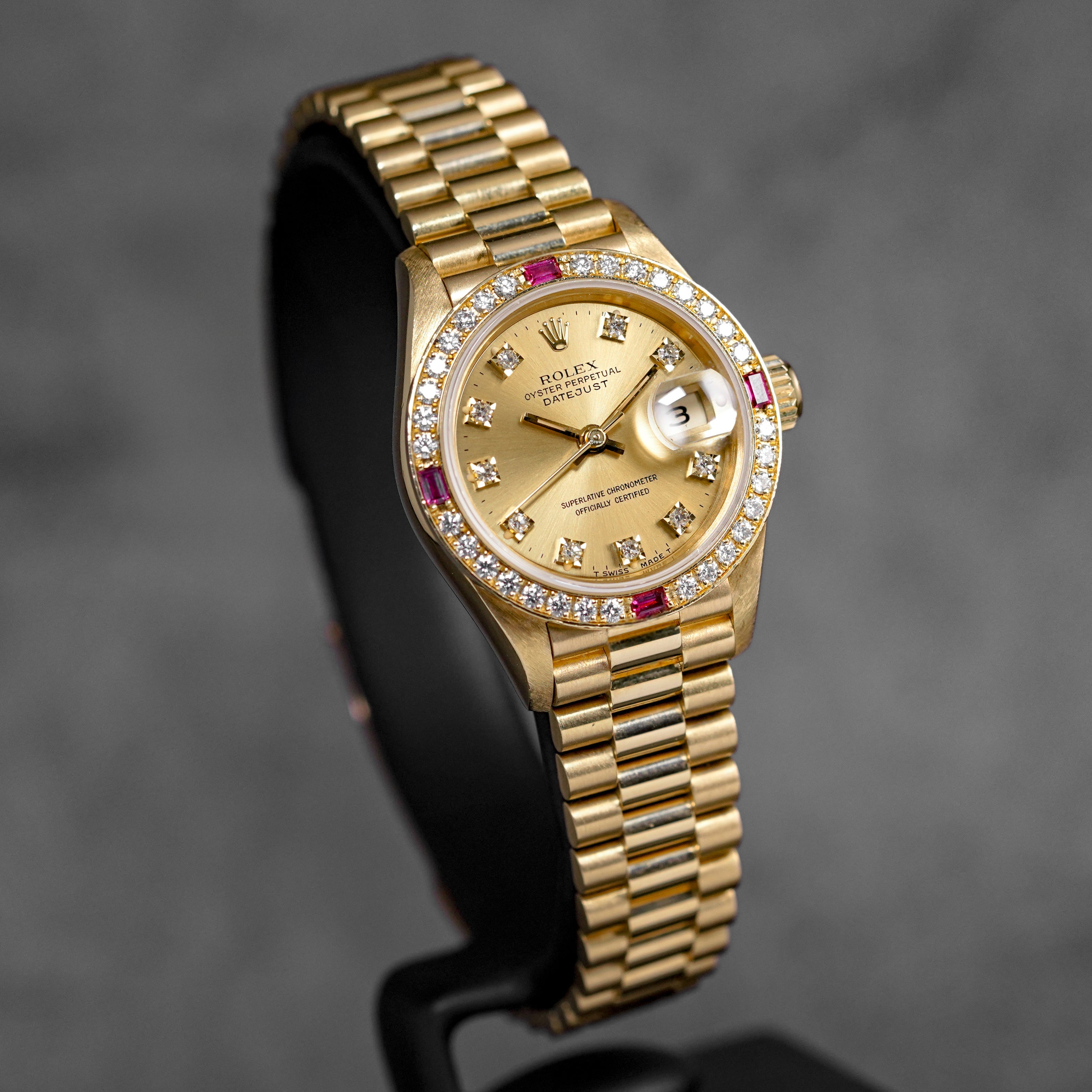 DATEJUST 26MM YELLOWGOLD CHAMPAGNE DIAMOND DIAL RUBY DIAMOND BEZEL (WATCH ONLY)